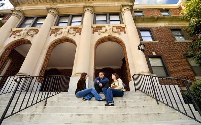 Students sitting on library steps